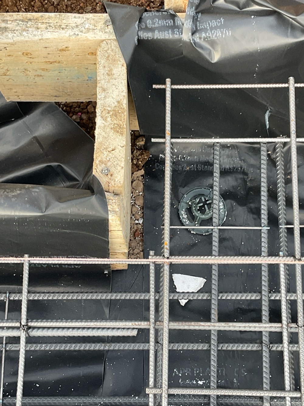 Vapour barrier not extended beneath the entire slab, recorded during a slab pre-pour inspection in Point Cook