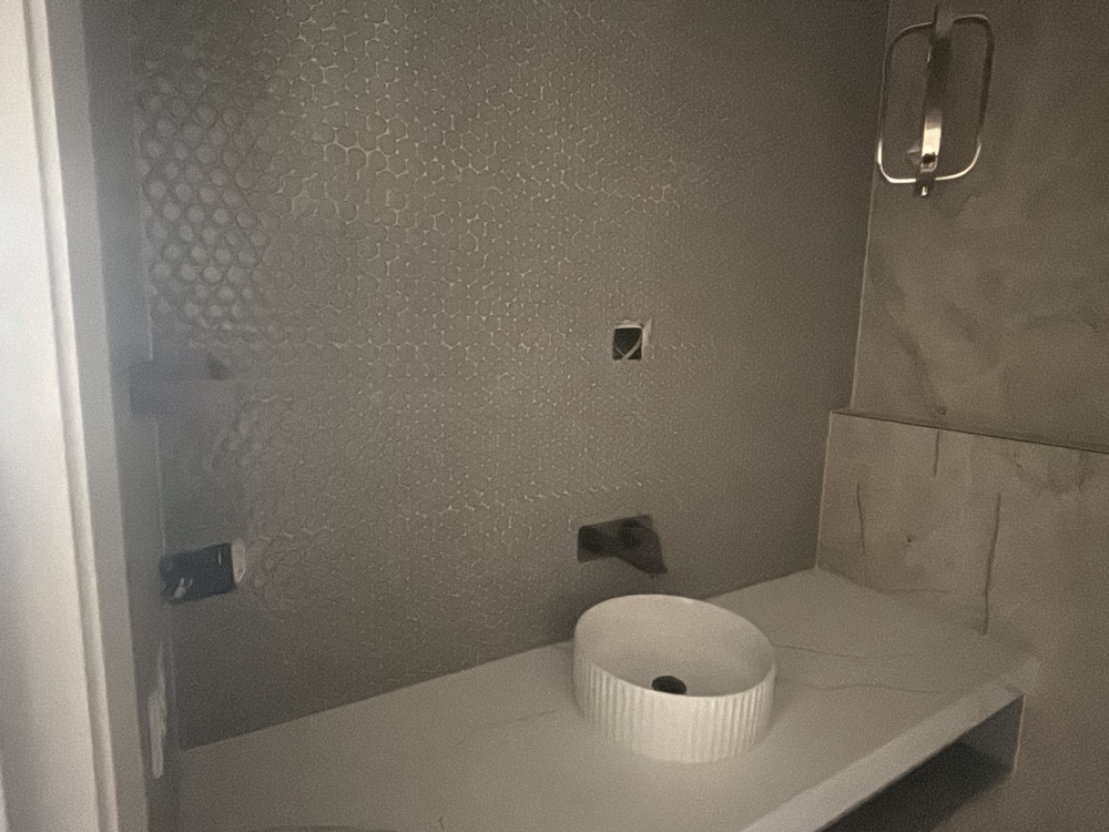 Bathroom mirror not completed at handover, recorded during a pre-handover inspection in Point Cook