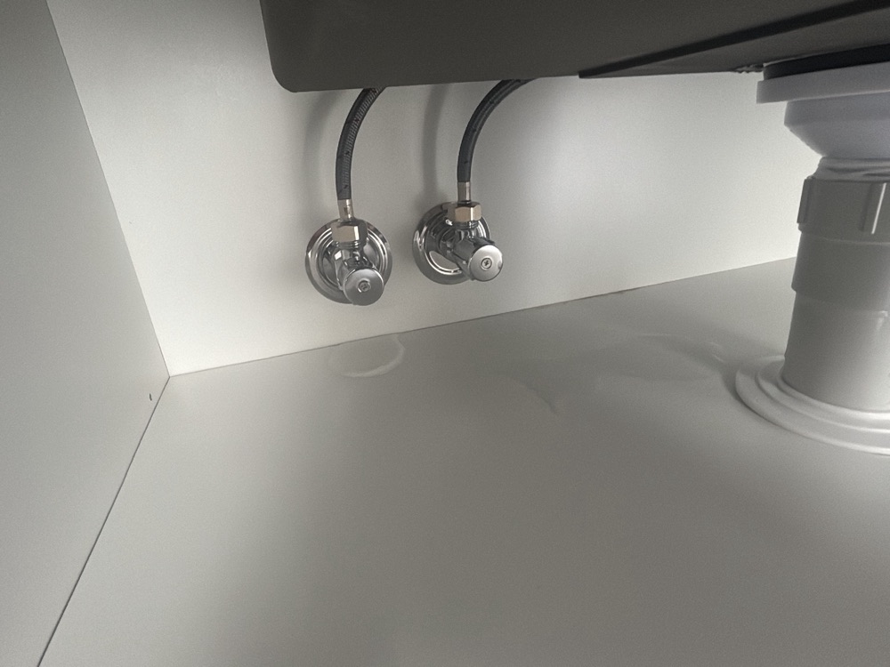 Sink waste pipework leaking at the time of inspection, recorded during a pre-handover inspection in Point Cook